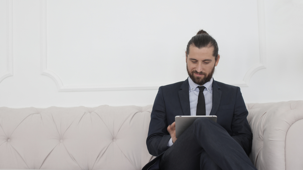 man reading about how to find a good real estate agent